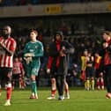 Sunderland players applaud their fans after their victory in the English FA Cup fourth round.