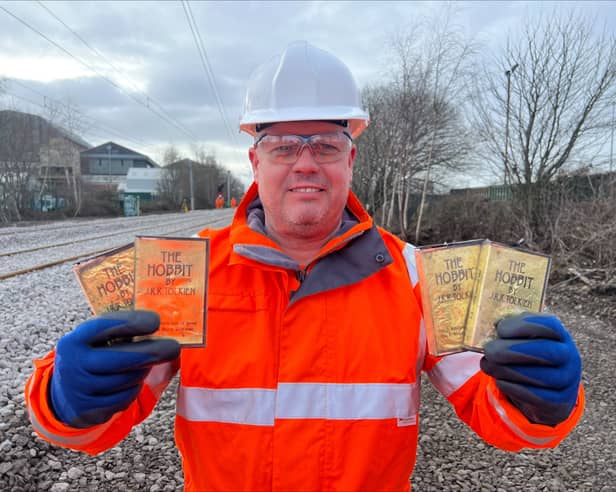 Metro worker Rob Cochrane with the audio cassettes of The Hobbit which were found on the Metro line.
