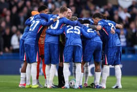 Paul Tierney finds himself in the middle of the Chelsea huddle.