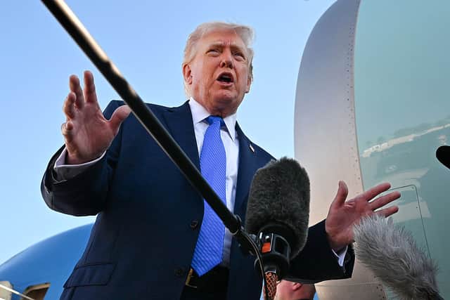 U.S. President Donald Trump speaks to reporters before boarding Air Force One at Palm Beach International Airport on March 23, 2026 in West Palm Beach, Florida. President Trump is traveling to Tennessee before returning to Washington. (Photo by Roberto Schmidt/Getty Images)