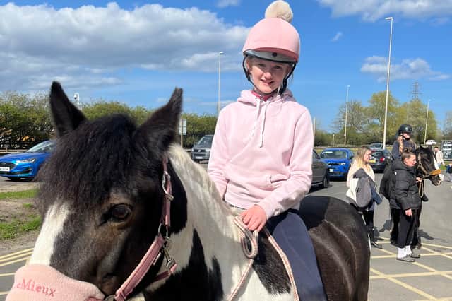 Scarlett Milner, 12, with her horse Jessie.