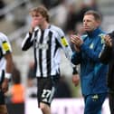 Newcastle United head coach Eddie Howe (r) Graeme Jones (2nd r) and players applaud the fans after  the Premier League match between Newcastle United and Bournemouth at St James' Park on April 18, 2026 in Newcastle upon Tyne, England. (Photo by Stu Forster/Getty Images)