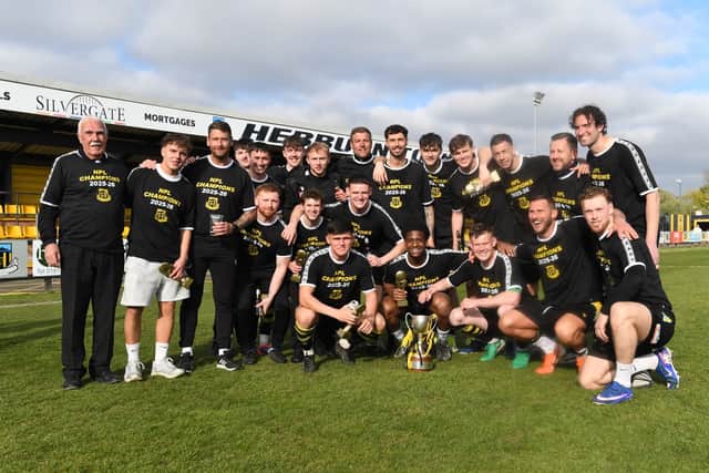 Chairman Vin Pearson (L) and the Hebburn Town squad and staff celebrate the club's Northern Premier League title win (photo Tyler Lopes)