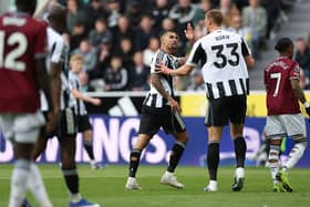 Bruno Guimaraes (l) and Dan Burn of Newcastle United exchange words during the Premier League match between Newcastle United and West Ham United at St James' Park on May 17, 2026 in Newcastle upon Tyne, England. (Photo by Stu Forster/Getty Images)