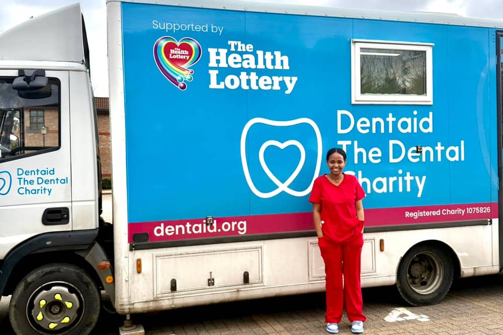 Dentaid mobile unit and a volunteer dental nurse.