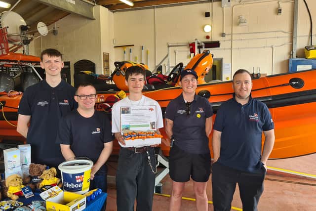 Luke Hedley, from Jarrow, with RNLI volunteers at the Sunderland Lifeboat Station.