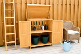 The compact wooden potting shed is designed to maximise storage space without taking over the garden