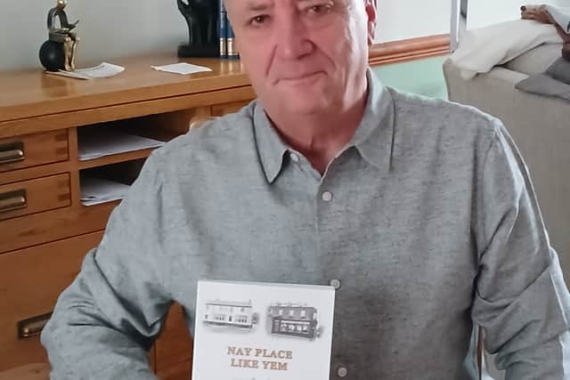 Haydn Watson with his newest book, 'Nay Place Like Yem'.