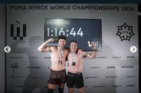 Lee Henry, left, with event partner Ronnie Downie celebrate completing the event.