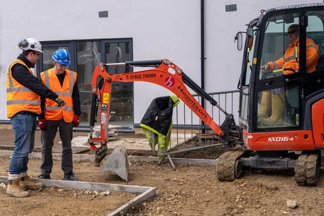 Kieran Pemberton, Robertson site manager (left), with Damien Lee, of Hewitson Limited (right), and Jack Grainger, a Sunderland College student who completed a work placement at the Griffin Court development.