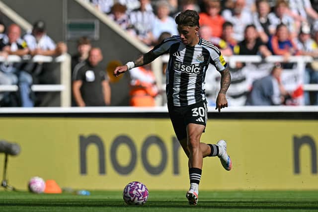 Newcastle United's Scottish defender #30 Harrison Ashby runs with the ball during the pre-season friendly football match between Newcastle United and Atletico Madrid at St James' Park in Newcastle-upon-Tyne, north east England on August 9, 2025. (Photo by ANDY BUCHANAN / AFP) (Photo by ANDY BUCHANAN/AFP via Getty Images)