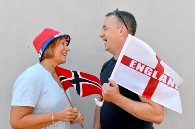 Husband and wife Derek and Hanne Pinkney who will have divided loyalties for the England-Norway World Cup game.
