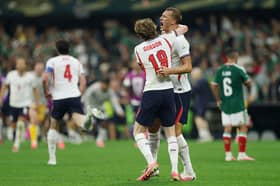 Anthony Gordon #18 and Dan Burn #15 of England celebrate the team's 3-2 victory after the FIFA World Cup 2026 Round of 16 match between Mexico and England at Mexico City Stadium on July 05, 2026 in Mexico City, Mexico. (Photo by Richard Pelham/Getty Images)
