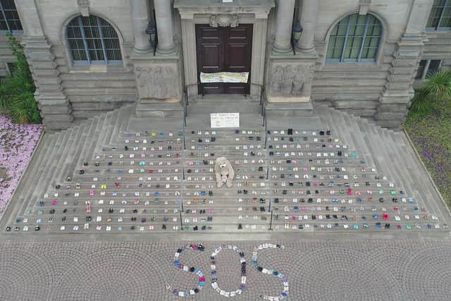 The Save Our Stanley's campaign group placed 402 pairs of children's shoes outside of South Shields Town Hall on Tuesday, July 14.