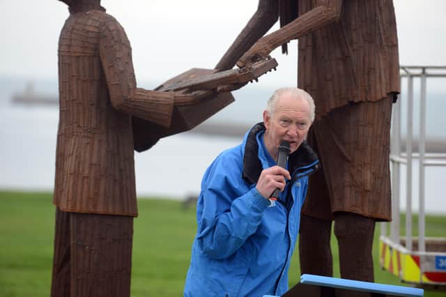 Brian Burnie speaking during the unveiling ceremony of the statue in December 2025.