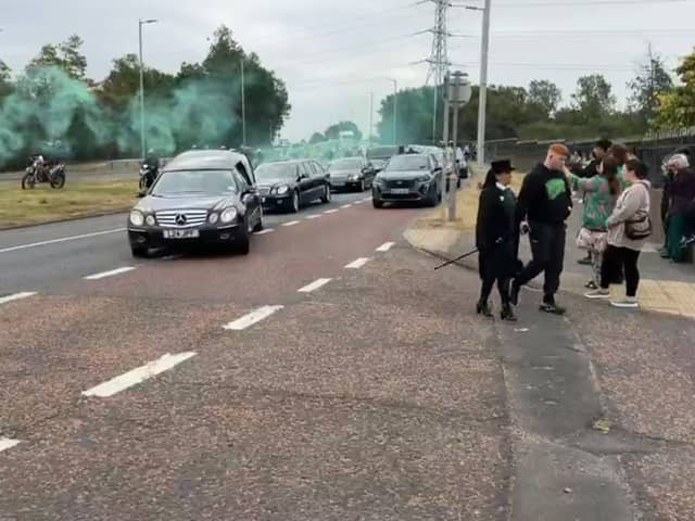 Green flares were set off as funeral cortege arrived at South Shields Crematorium. 