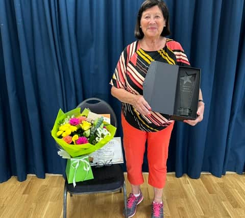 Muriel Metcalfe celebrates 60 years with the Brownies.