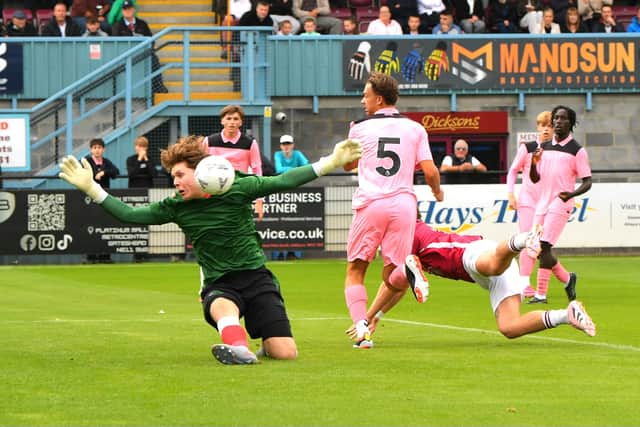 Sunderland U21s keeper Isaac Allan keeps out a header from South Shields forward Cedwyn Scott (photo Kevin Wilson)
