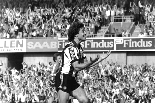 Newcastle United player Kevin Keegan celebrates towards the Gallowgate End after scoring the winning goal on his debut in the Second Division match against Queens Park Rangers at St James' Park on August 28th, 1982 in Newcastle upon Tyne, England. (Photo by Danny Brannigan/Hulton Archive)