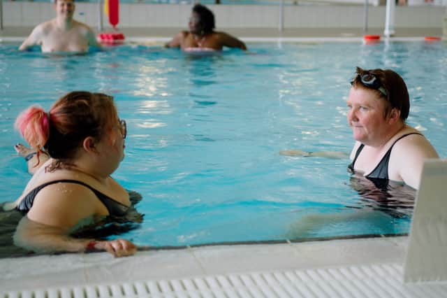 Amy (right) in the pool taking part in the Aqua Circuit programme, which has helped boost her confidence to find employment.
