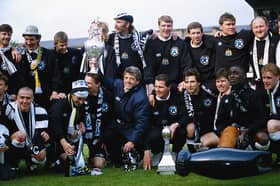 Newcastle United manager Kevin Keegan holds the League Division One trophy after the League Division One match against Leicester City at St James' Park on May 9, 1993 in Newcastle, England,( Back row left to right) Paul Bracewell, Terry McDermott (Assistant manager) Mark Robinson, Barry Venison (obscured) Brian Kilcline, Tommy Wright, Kevin Sheedy, Derek Fazackerley (coach) Derek Wright (physio) and Scott Sellars, (front row left to right) John Beresford, Lee Clark, David Kelly, Steve Howey (partially obscured) KK, Liam O' Brien, Gavin Peacock, Robert Lee, Andy Cole and Kevin Scott. (Photo by Stevie Morton/Allsport/Getty Images)
