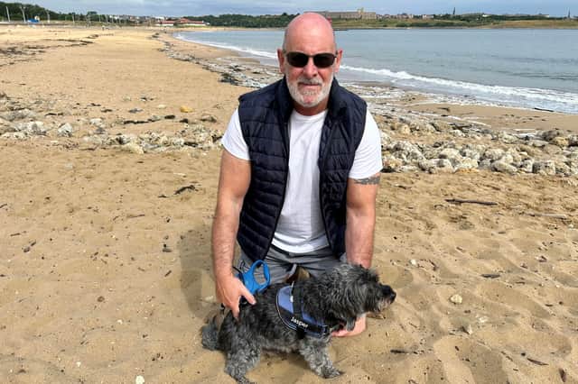 Dog walker Jeff Beaty and his dog Jasper.