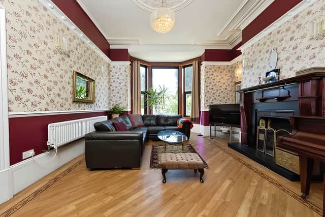 Generous reception space and original character features create welcoming rooms for both entertaining and quiet evenings at home.