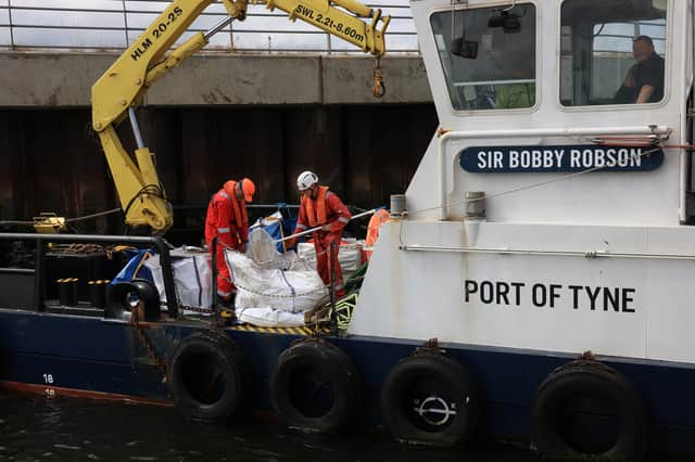Plastic pellets are collected on the river and loaded onto the vessel Sir Bobby Robson pic2