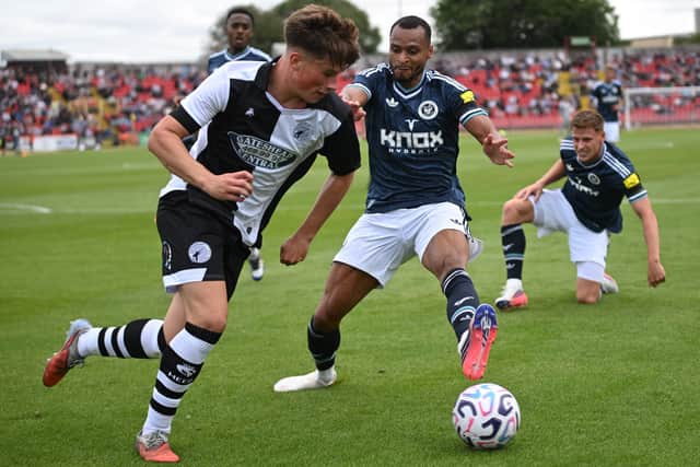 Gateshead defender Tommy Lavery battles for possession with Newcastle United winger Jacob Murphy (photo Tyler Lopes)
