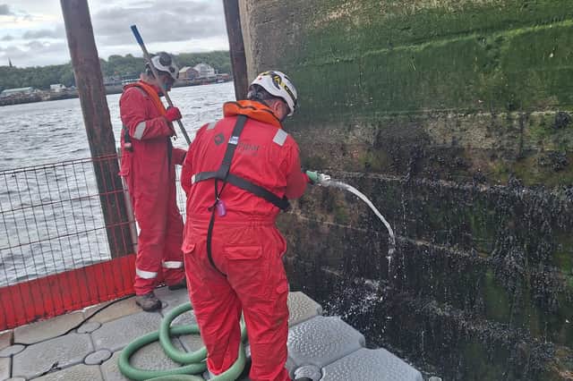 Workers flush out pellets at North Shields Ferry Terminal
