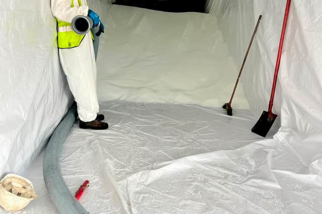 Port of Tyne workers clear nurdles from a container.