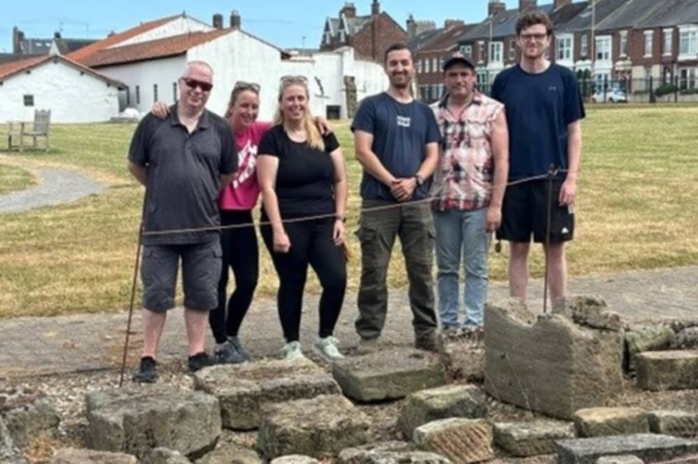 The UK Docks team with the remodelled stone park at the Arbeia Roman Fort.