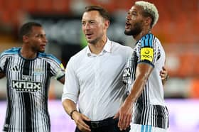 Matthias Jaissle, Head Coach of Newcastle United, laughs with Joelinton of Newcastle United following the pre-season friendly match between Valencia CF and Newcastle United at Estadio Mestalla on August 08, 2026 in Valencia, Spain. (Photo by Clive Brunskill/Getty Images)