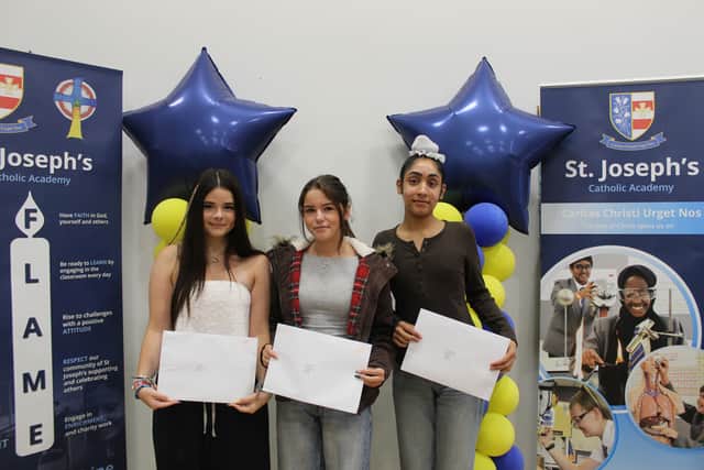 St Joseph's Catholic Academy pupils Hartegh, Katie and Emily with their GCSE results.