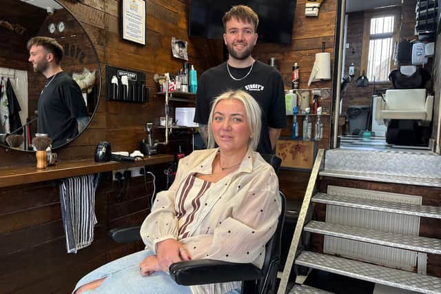 Liam with Lyndsey Stone, Allan Stone's sister. Lyndsey has been helping to run the shop following Allan's sudden death in 2021.