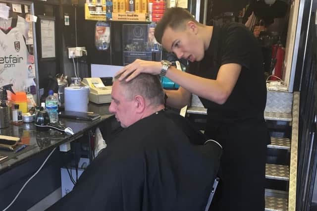 Liam started working at Stoney's Barber Shop in December 2015. Allan took him under his wing and trained him to be a barber. Pictured is Liam carrying out his first haircut.