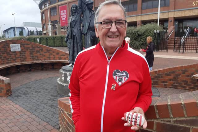 Heaven Branch treasurer, John Hellens, and the pebble in memory of his wife Vivian, who passed away in 2021.