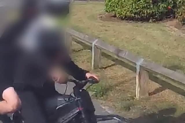 Video footage shows undercover officers from Northumbria Police stopping an illegal bike in South Shields.
