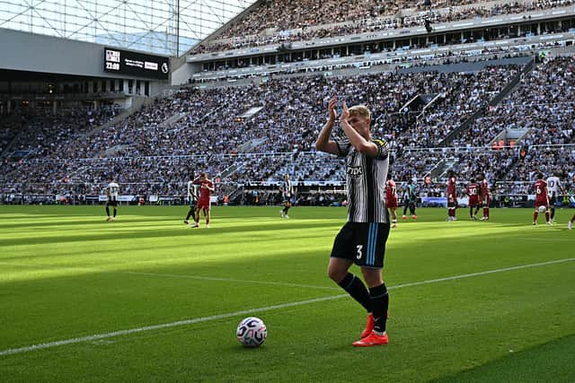 Newcastle United's English midfielder #03 Lewis Hall applauds as he goes to take a corner during the English Premier League football match between Newcastle United and Liverpool at St James' Park in Newcastle-upon-Tyne, north east England on August 23, 2026. (Photo by Paul ELLIS / AFP via Getty Images)
