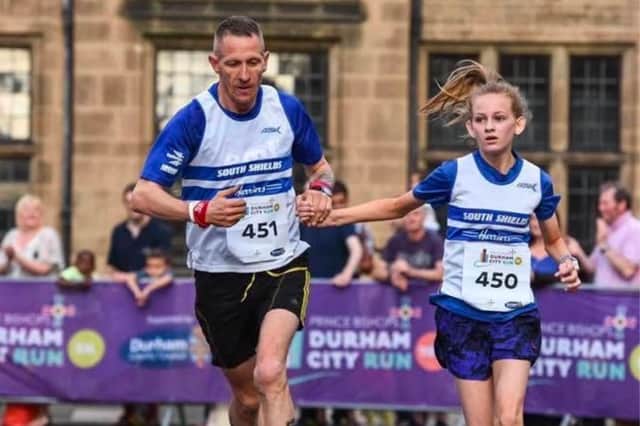 Katie Wood running with her dad, Mark, before his death in 2017.