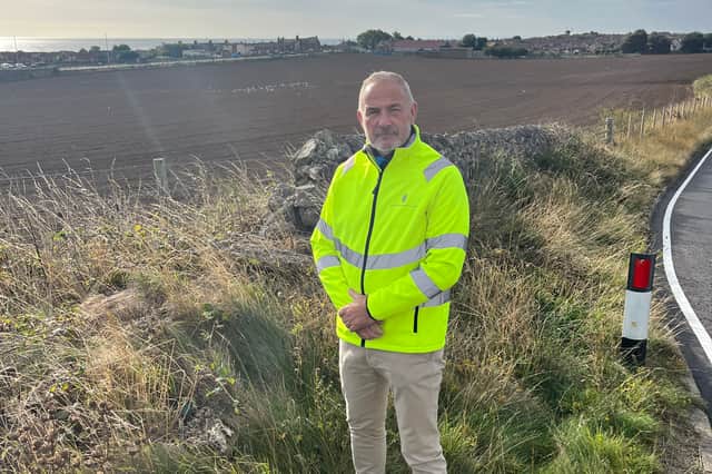 Cllr Dave Royal at the planned development site, from Lizard Lane.