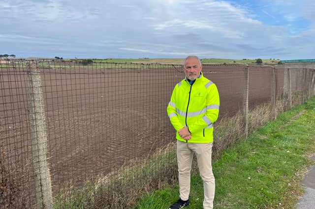 Cllr Dave Royal at the planned development site at Mill Lane.