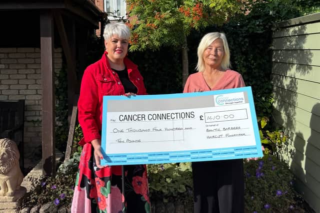 Inese Hunter (left), owner of Baltic Barbers, with Deborah Roberts, the co-founder/manager of Cancer Connections.