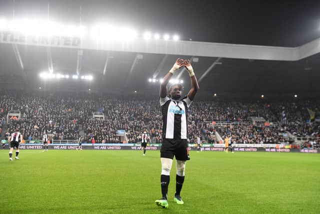 Newcastle player Allan Saint-Maximin makes a heart shape sign with his hands towards the stand before the Premier League match between Newcastle United and Manchester United at St. James Park on December 27, 2021 in Newcastle upon Tyne, England. (Photo by Stu Forster/Getty Images)