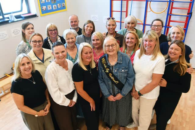 Carol with current and former members of staff at Toner Avenue Primary School.