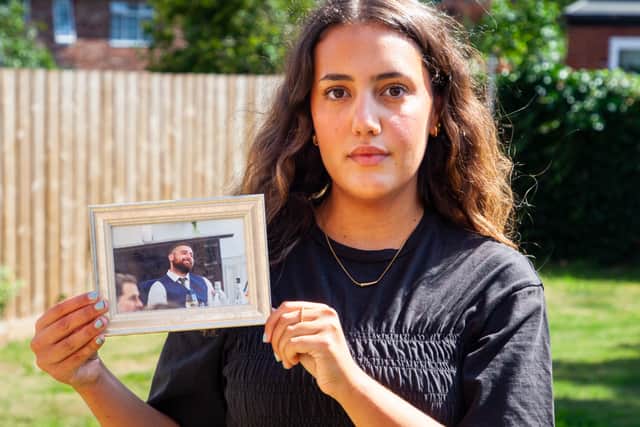 Anissa Khalfa, from Jarrow, holding a photo of her cousin Tom, who passed away after struggling with alcohol addiction and mental health issues.