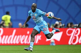 Congo DR's forward #20 Yoane Wissa eyes the ball during the 2026 World Cup round of 32 match football between England and the Democratic Republic of Congo at the Atlanta Stadium in Atlanta on July 1, 2026.  (Photo by ROBERTO SCHMIDT / AFP via Getty Images)