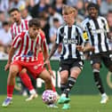 Newcastle United's English midfielder #44 Alfie harrison (C) plays a pass during the pre-season friendly football match between Newcastle United and Atletico Madrid at St James' Park in Newcastle-upon-Tyne, north east England on August 9, 2025. (Photo by ANDY BUCHANAN / AFP) (Photo by ANDY BUCHANAN/AFP via Getty Images)          