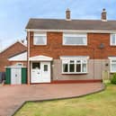 The Gibson Court semi-detached home occupies a generous corner plot with a large block-paved driveway