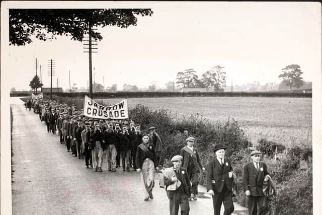 The Jarrow marchers, marching with a 'Jarrow Crusade' banner. (Photo by Hulton Archive/Getty Images)